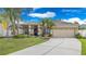 Charming single-story home with a well-manicured lawn and inviting curb appeal at 1319 Castleport Rd, Winter Garden, FL 34787