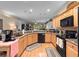 Well-equipped kitchen with granite countertops, stainless steel appliances, and ample cabinet space at 1319 Castleport Rd, Winter Garden, FL 34787