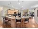 Open kitchen with breakfast bar, pendant lighting, and seamlessly connecting to the dining area at 1319 Castleport Rd, Winter Garden, FL 34787