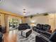 Spacious living room with comfortable seating and sliding glass doors to the patio at 1319 Castleport Rd, Winter Garden, FL 34787
