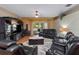 View of the living room with media center, seating area, and natural light at 1319 Castleport Rd, Winter Garden, FL 34787