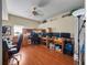 Spacious home office with wood floors, multiple workstations, and natural light at 1319 Castleport Rd, Winter Garden, FL 34787