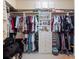 A walk-in closet with shelving, drawers, and plenty of room for storage at 1319 Castleport Rd, Winter Garden, FL 34787