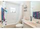 Bathroom with a tub, shower, and basic fixtures at 13780 Sw 78Th Pl, Dunnellon, FL 34432