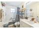 Bathroom with a shower, toilet, shelving, and sink at 13780 Sw 78Th Pl, Dunnellon, FL 34432