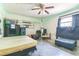 Bedroom featuring a ceiling fan and unkempt decor at 13780 Sw 78Th Pl, Dunnellon, FL 34432