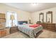 Bedroom with furniture and a window at 13780 Sw 78Th Pl, Dunnellon, FL 34432