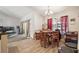 Cozy dining area with wood flooring and a chandelier, perfect for Gathering meals at 13780 Sw 78Th Pl, Dunnellon, FL 34432