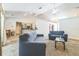 Bright living room with an open floor plan connecting to the kitchen at 13780 Sw 78Th Pl, Dunnellon, FL 34432