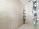 Bathroom shower with neutral tiling and shower caddy at 13780 Sw 78Th Pl, Dunnellon, FL 34432