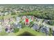 Aerial view of backyard with a pinpoint marking location, screened pool, and wooded surroundings at 14545 Braddock Oak Dr, Orlando, FL 32837