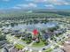 Aerial view of a lakeside property with a pinpoint marking its location in the neighborhood at 14545 Braddock Oak Dr, Orlando, FL 32837
