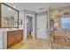 A stylish bathroom offers a glass shower, and spacious vanity with ample counter space at 14545 Braddock Oak Dr, Orlando, FL 32837