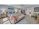 Spacious primary bedroom boasts a sitting area, stylish decor, and ample natural light at 14545 Braddock Oak Dr, Orlando, FL 32837