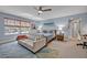 Serene bedroom featuring a lake view, seating area, and a soothing color palette at 14545 Braddock Oak Dr, Orlando, FL 32837
