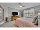 Comfortable bedroom features a spacious layout, natural light, and simple furnishings at 14545 Braddock Oak Dr, Orlando, FL 32837