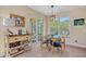 Bright breakfast nook with tile flooring and sliding doors to the outdoor living area at 14545 Braddock Oak Dr, Orlando, FL 32837