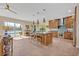 Spacious kitchen featuring island, stainless steel appliances, custom wooden cabinets and plenty of counter space at 14545 Braddock Oak Dr, Orlando, FL 32837