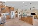 Spacious kitchen with stainless steel appliances, custom cabinetry, and a view into the living area at 14545 Braddock Oak Dr, Orlando, FL 32837