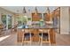 Beautiful kitchen featuring custom wood cabinets, stainless steel appliances, and a large island with bar seating at 14545 Braddock Oak Dr, Orlando, FL 32837