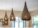 Pendant lighting in the kitchen area adding warmth and style to the space at 14545 Braddock Oak Dr, Orlando, FL 32837