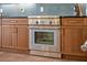 Stainless steel oven within custom wood cabinetry, for functionality and modern design at 14545 Braddock Oak Dr, Orlando, FL 32837