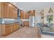 Modern kitchen features wooden cabinets, stainless steel appliances, and elegant tile backsplash for a chic design at 14545 Braddock Oak Dr, Orlando, FL 32837