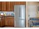Stainless refrigerator complementing the custom cabinetry, blending style and utility at 14545 Braddock Oak Dr, Orlando, FL 32837