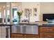 Farmhouse stainless sink and countertops, creating a functional space at 14545 Braddock Oak Dr, Orlando, FL 32837
