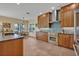 Well-equipped kitchen with stainless steel appliances, dark countertops, and a breakfast nook overlooking the water at 14545 Braddock Oak Dr, Orlando, FL 32837