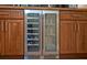 Dual zone wine and beverage cooler built into custom cabinetry, a perfect beverage center at 14545 Braddock Oak Dr, Orlando, FL 32837