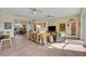 Sunlit living room featuring tile floors, neutral walls, and stylish furnishings for comfortable and inviting living at 14545 Braddock Oak Dr, Orlando, FL 32837