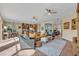 Expansive living room with a modern kitchen and dining area providing ample space for entertaining and everyday living at 14545 Braddock Oak Dr, Orlando, FL 32837