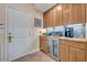 Convenient pantry area with built-in cabinets, countertop appliances, and beverage center at 14545 Braddock Oak Dr, Orlando, FL 32837