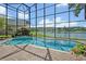 Enclosed pool area offering scenic lake views at 14545 Braddock Oak Dr, Orlando, FL 32837
