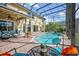 Spacious outdoor patio with a pool, lounge chairs, and lush landscaping for relaxation and enjoyment at 14545 Braddock Oak Dr, Orlando, FL 32837