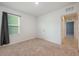 Simple bedroom with a window and closet, ideal for a guest or room at 1511 Barberry Dr, Kissimmee, FL 34744