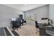 Bright room with two workstations, dual monitors, and a gray wall, suitable for home office or study at 1511 Barberry Dr, Kissimmee, FL 34744
