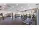 Spacious fitness center filled with modern equipment, treadmills, weight machines, and ample natural light at 1511 Barberry Dr, Kissimmee, FL 34744