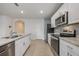 Well-equipped kitchen with granite counters, stainless steel appliances, and ample cabinet space at 1511 Barberry Dr, Kissimmee, FL 34744