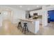 Modern kitchen with stainless steel appliances, granite countertops, and an island with seating at 1511 Barberry Dr, Kissimmee, FL 34744
