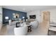 Bright living room featuring a modern design, stylish furniture, and an accent wall at 1511 Barberry Dr, Kissimmee, FL 34744