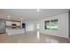 Bright, open living area with tile floors, breakfast bar, stainless appliances, and a seamless flow for modern living at 1511 Barberry Dr, Kissimmee, FL 34744