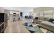 Open-concept living area with kitchen island, dining space and comfortable seating arrangement at 1511 Barberry Dr, Kissimmee, FL 34744