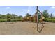Community playground with a slide and swing set for outdoor fun at 1511 Barberry Dr, Kissimmee, FL 34744