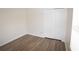 Bedroom featuring closet, wood-look flooring, neutral paint, and baseboards at 15349 Oak Apple Ct # B, Winter Garden, FL 34787