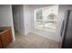 Bright breakfast nook featuring a large window and tiled floors and natural light at 15349 Oak Apple Ct # B, Winter Garden, FL 34787