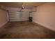 Spacious two car garage with concrete floor and overhead door at 15349 Oak Apple Ct # B, Winter Garden, FL 34787