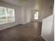 Well-lit living room with modern flooring and large windows, creating a welcoming and open atmosphere at 15349 Oak Apple Ct # B, Winter Garden, FL 34787