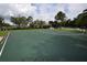 Community basketball court on sunny day, with clubhouse in the background at 15349 Oak Apple Ct, Winter Garden, FL 34787